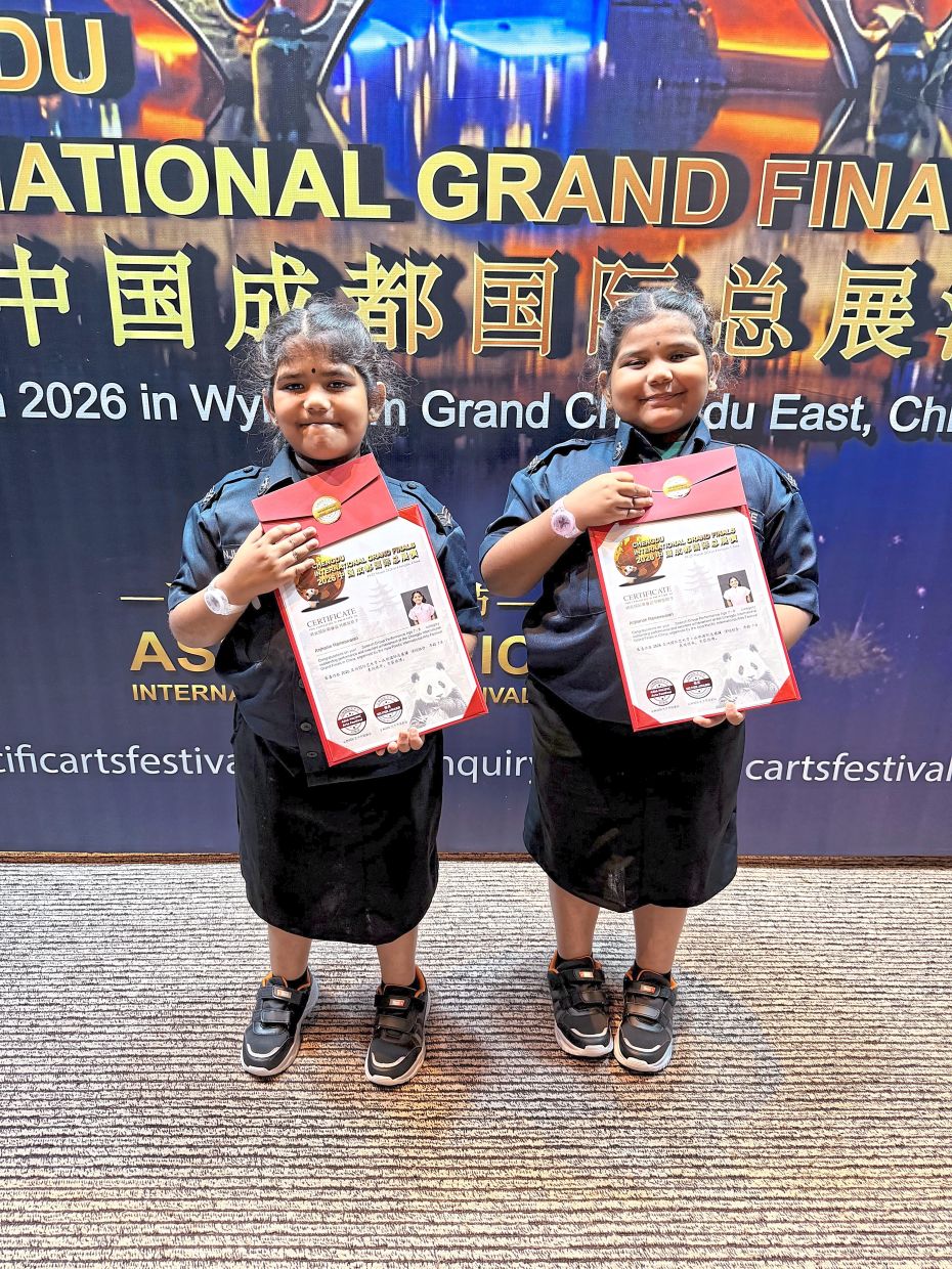 Radiating confidence: Anjhanie (left) and Anjhanah posing with their awards at Speech of Asia 2026 in Chengdu, China.