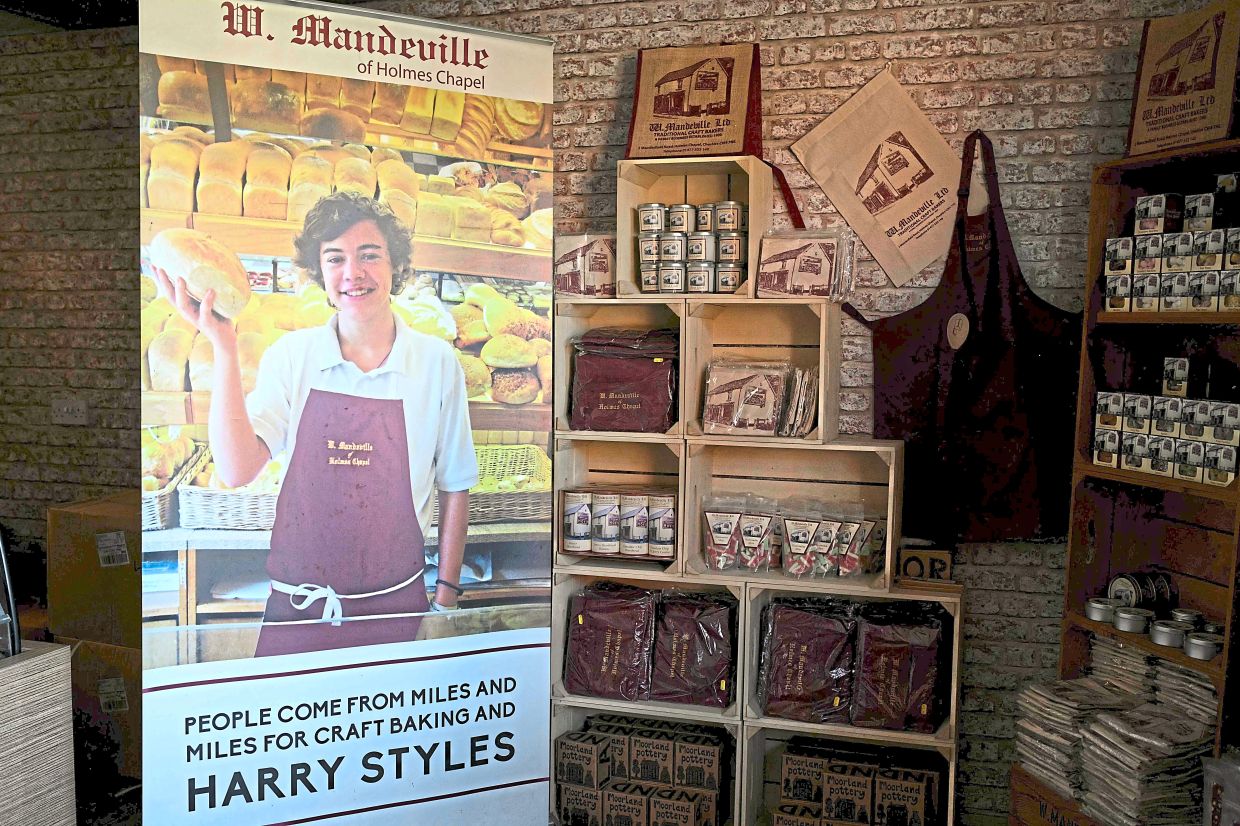 A poster of Styles from when he worked at the W Mandeville bakery. Photos: AFP