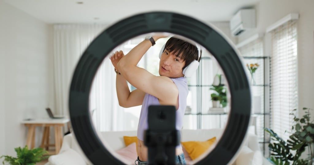 A man live-streams while wearing headphones. Many people fear artificial intelligence technology has become a tool for scammers. - Photo: Shutterstock