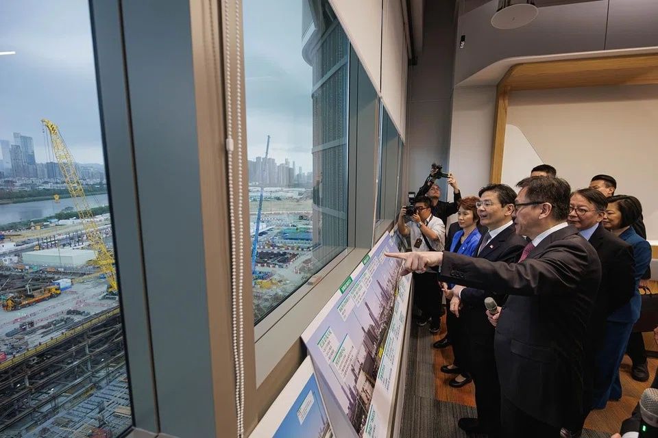 Prime Minister Lawrence Wong (second from right) visited the Northern Metropolis in Hong Kong on March 27. -- PHOTO: MDDI
