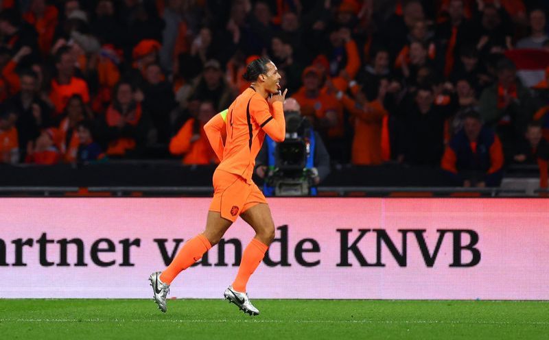 Soccer-Dutch coach Koeman praises performance but Van Dijk wants more