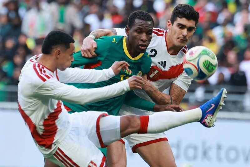 Soccer-Defiant Senegal display Afcon trophy before beating Peru in friendly