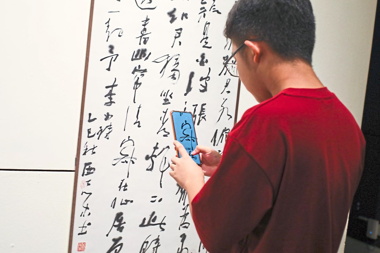 Across the exhibition, calligraphy also features prominently, showcasing how tradition is preserved and reinterpreted. Photo: The Star/Leong Wai Yee