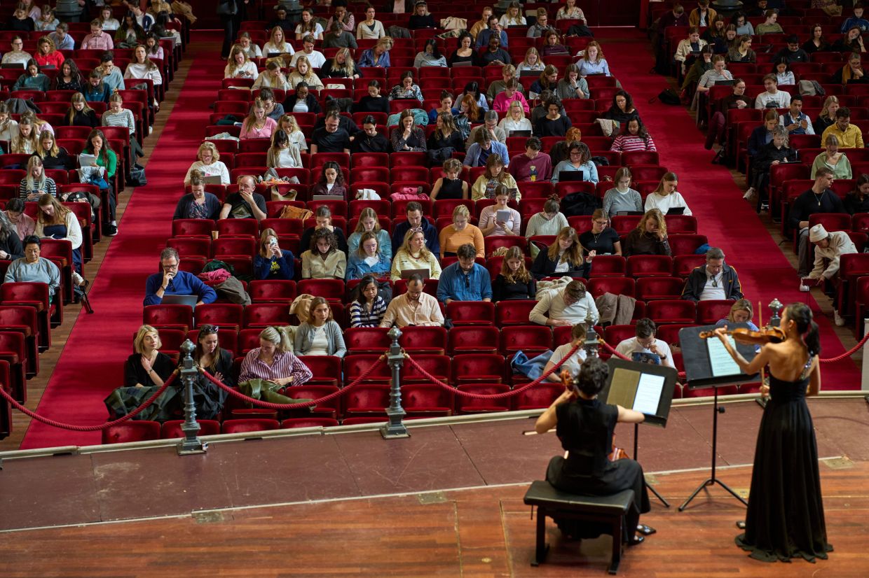 Violinist Hyunjin Cho and cellist Efstratia Chaloulakou perform for students studying with music at Concertgebouw in Amsterdam, Netherlands, on March 5, 2026.