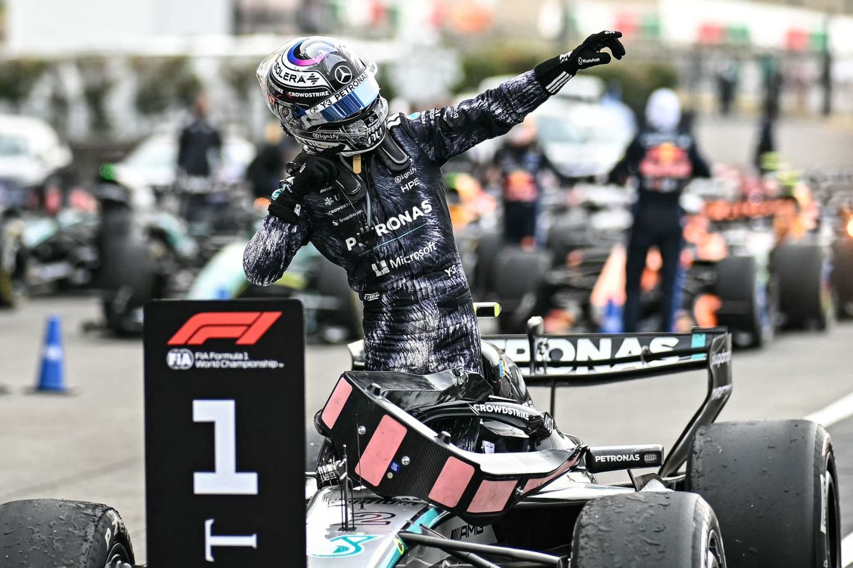 Mercedes' Italian driver Kimi Antonelli celebrates at the parc ferme after winning the Formula One Japanese Grand Prix at the Suzuka circuit in Suzuka, Mie prefecture on Sunday, March 29, 2026. -- Photo by Philip FONG / AFP