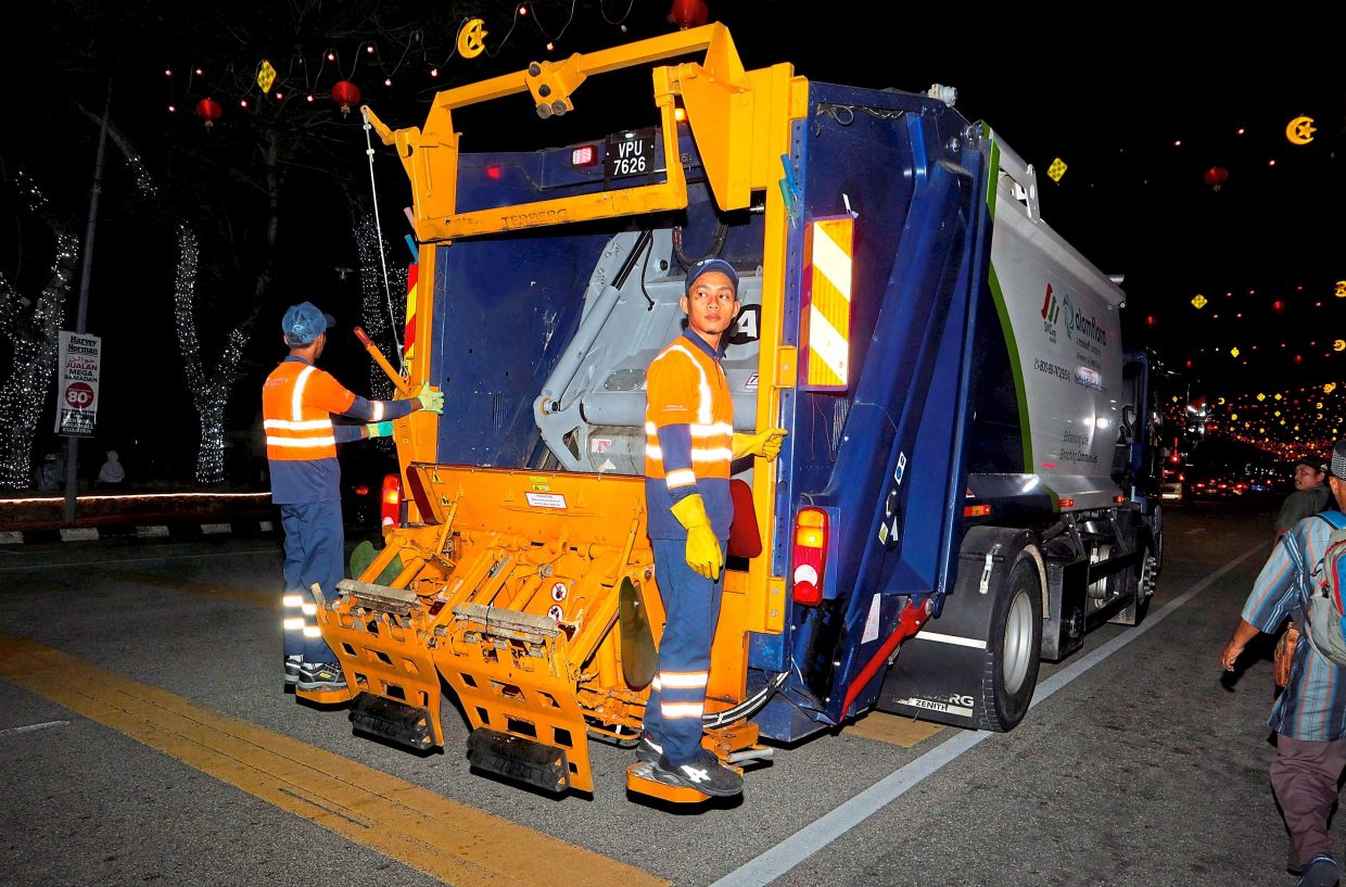 A rubbish compactor during his night shift