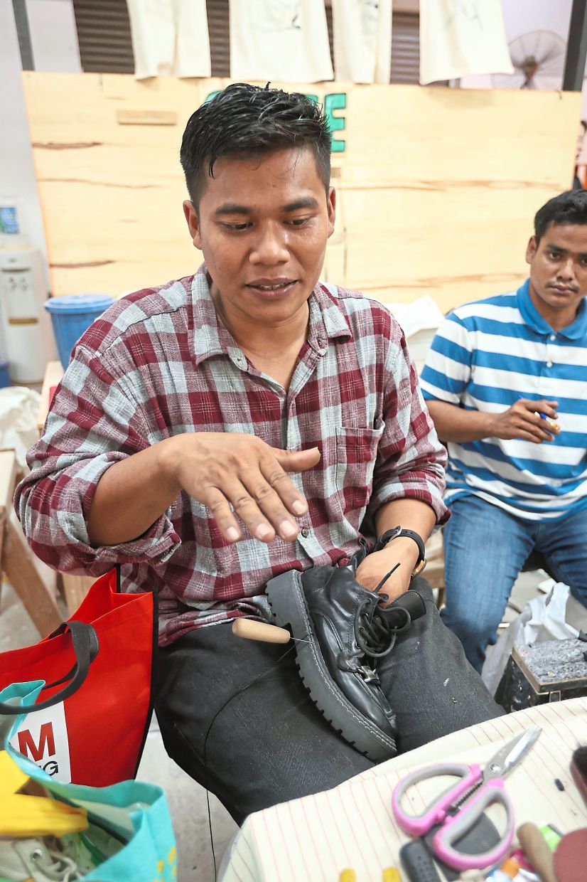 Muhammad Husni emphasises the importance of keeping shoe repair costs affordable.