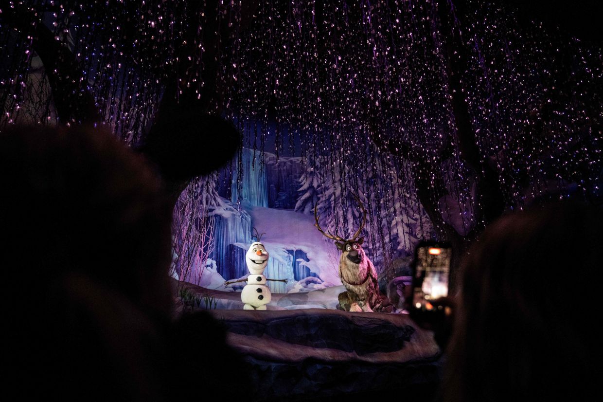 The 'Frozen Ever After' attraction is found within the 'World of Frozen'. 