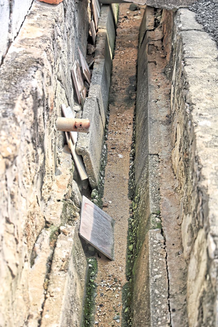 Residents worry that damaged drains are causing water seepage.