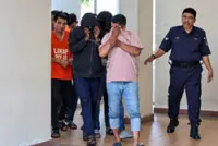 Eight charged with injuring three cops