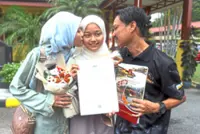 Tears flow as eldest child scores 9As