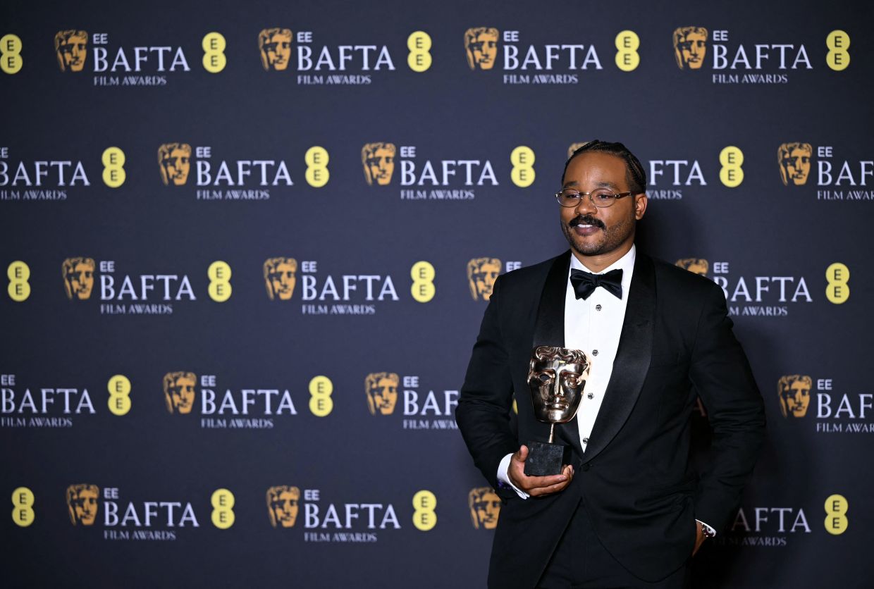 Ryan Coogler poses with the award of the night at the 2026 Baftas. Photo AFP