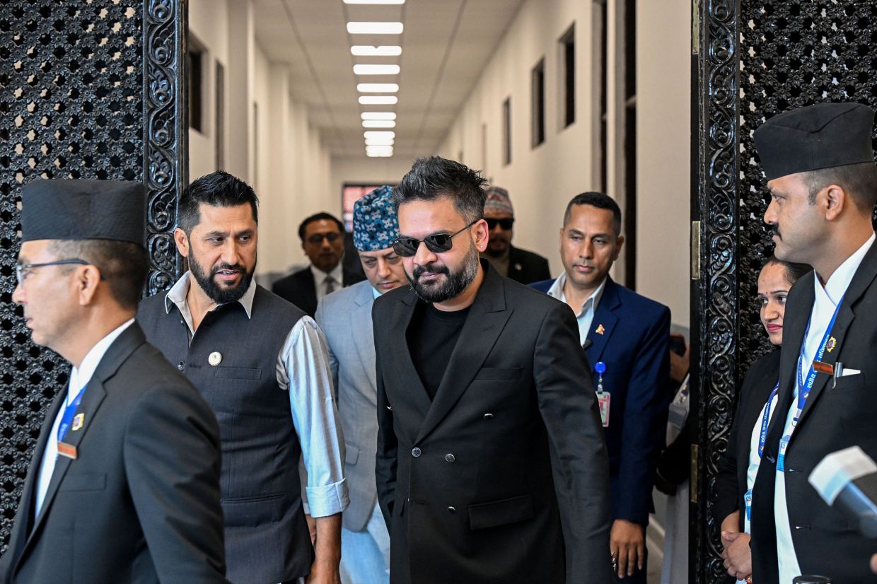 Nepal's Prime Minister Balendra Shah (centre) and Rastriya Swatantra Party President Rabi Lamichhane (second left) ariving to attend the parliament session in Kathmandu on April 2, 2026. - AFP