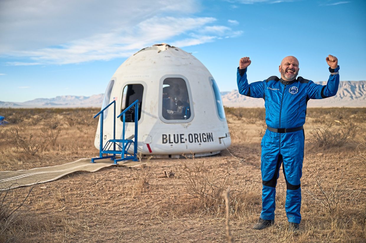 Space tourist Adonis Pouroulis after a successful Blue Origin mission on Dec 20, 2025. — blueorigin.com
