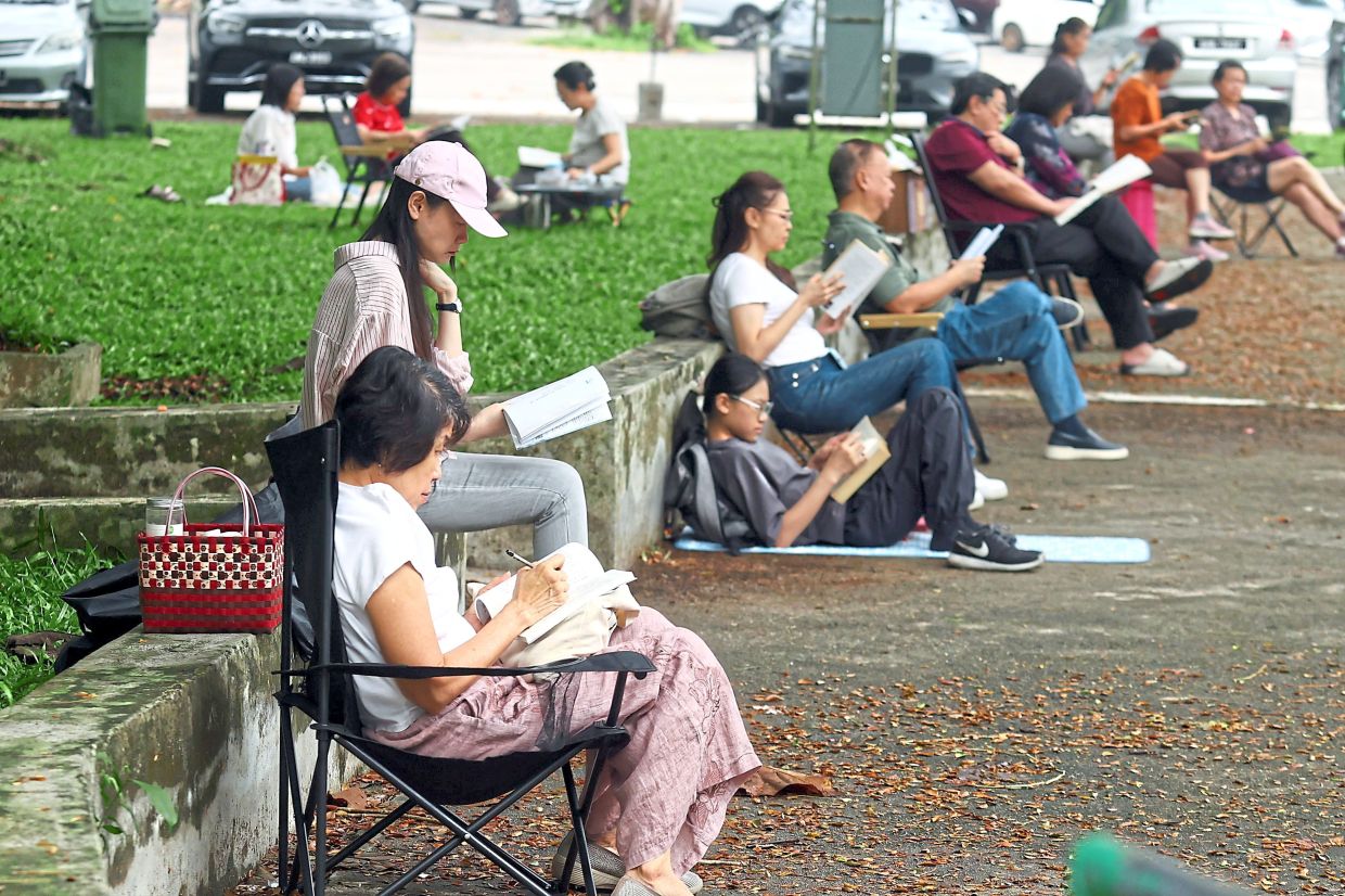 The park provides a picnic-like environment for families to gather and read together. — Photos: RONNIE CHIN and IVAN LOH/The Star and courtesy photos The Ipoh Reads initiative, which takes place three times a month at DR Seenivasagam Recreational Park, aims to reclaim public spaces for intellectual growth.