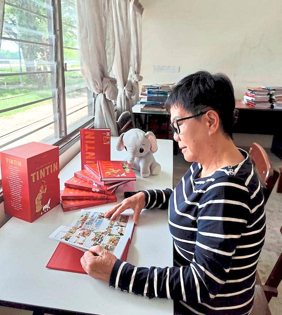 A visitor enjoying some quiet reading time at Perak Women for Women Society’s Book and Cafe Corner in Ipoh.