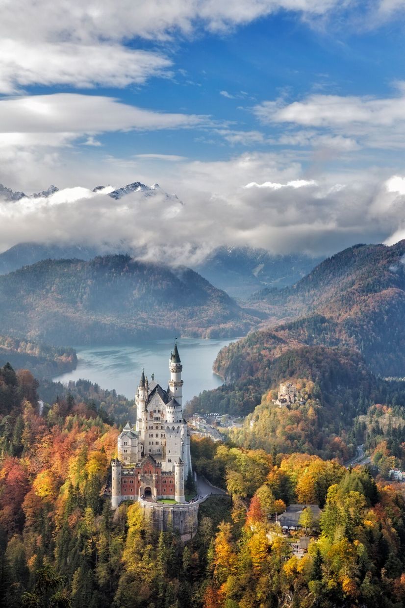Embark on a meaningful journey to Germany’s Neuschwanstein Castle, a fairytale set in breathtaking autumn scenery.