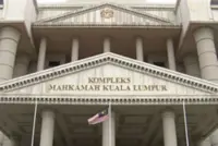 DOE D-G, deputy arrive in court to face corruption charges