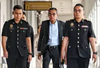 DOE D-G claims trial to RM100,000 corruption charge