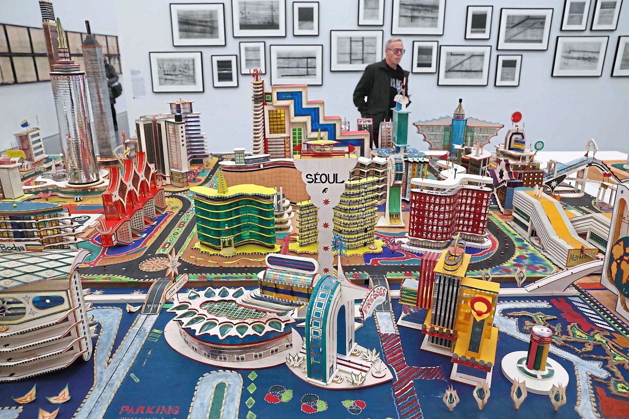 A person looks at works from 'New Humans: Memories Of The Future' at the New Museum in New York. Photo: AFP 