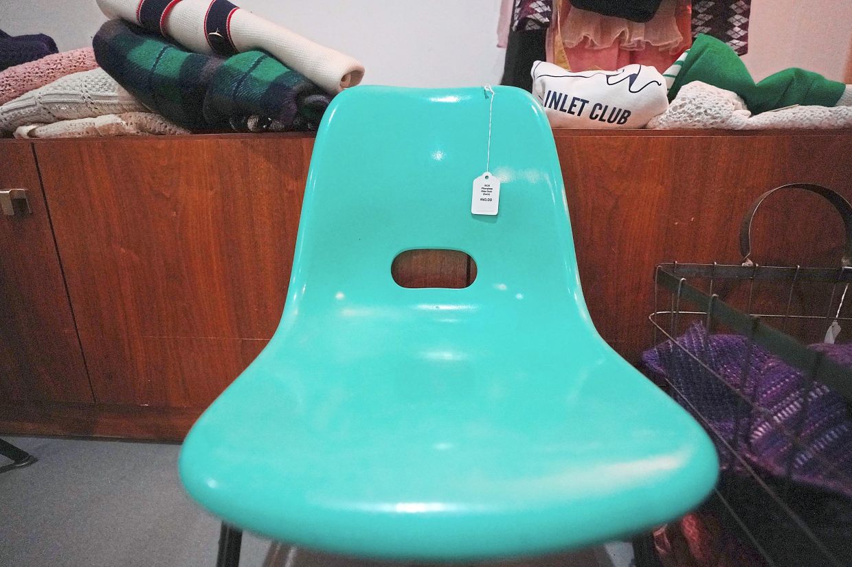 A chair is for sale at Mothership, a vintage and thrift store, Thursday, March 26, 2026, in New York. (AP Photo/Alyssa Goodman)