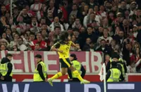 Soccer-Dortmund score twice in stoppage time to beat Stuttgart 2-0