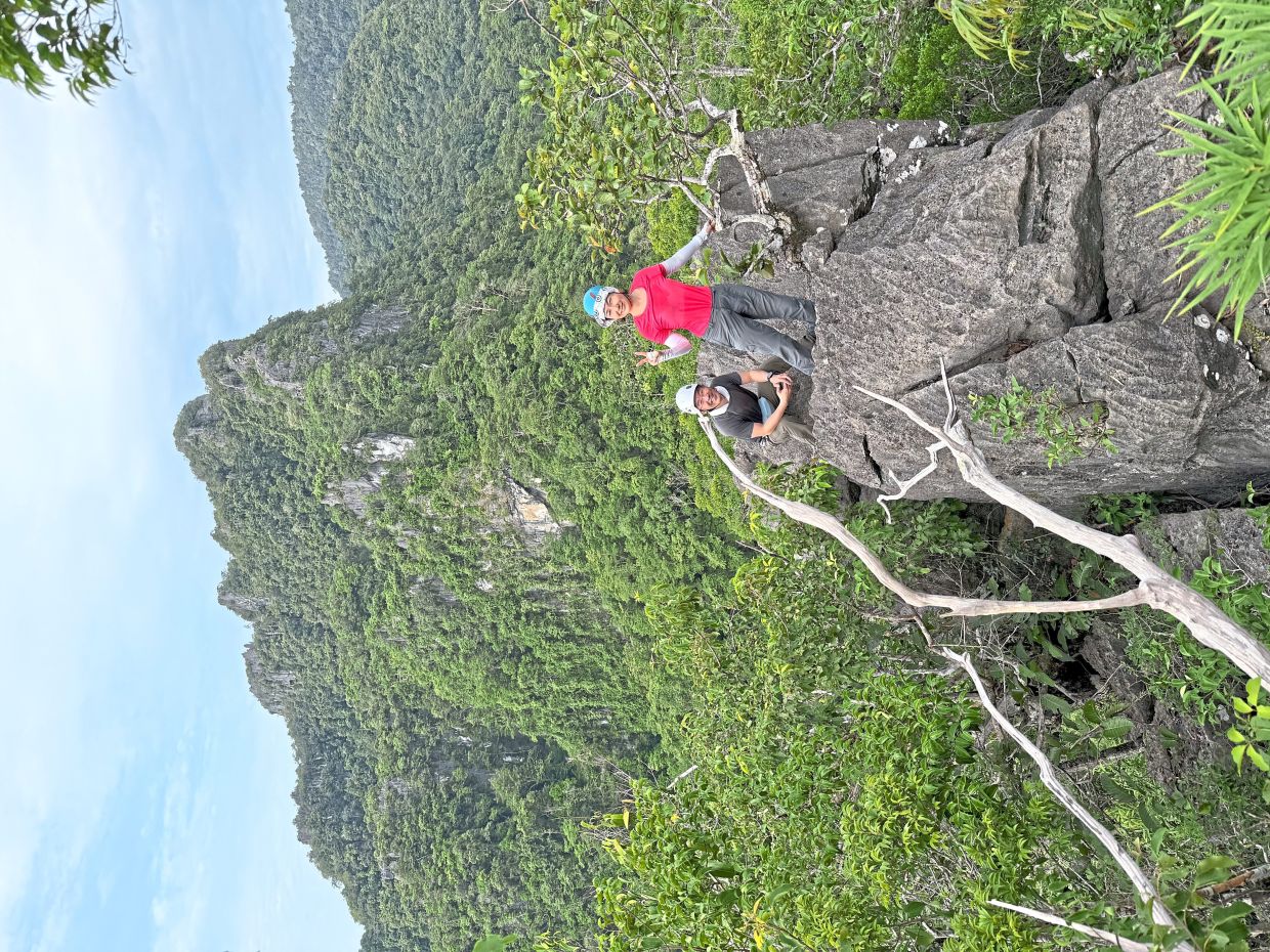 The writer (left) with his wife, Poh Koon, at Wang Mu Mountain. 
