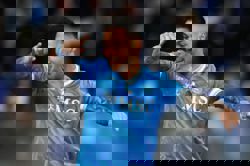 Soccer-Napoli edge Milan to keep Serie A title hopes alive