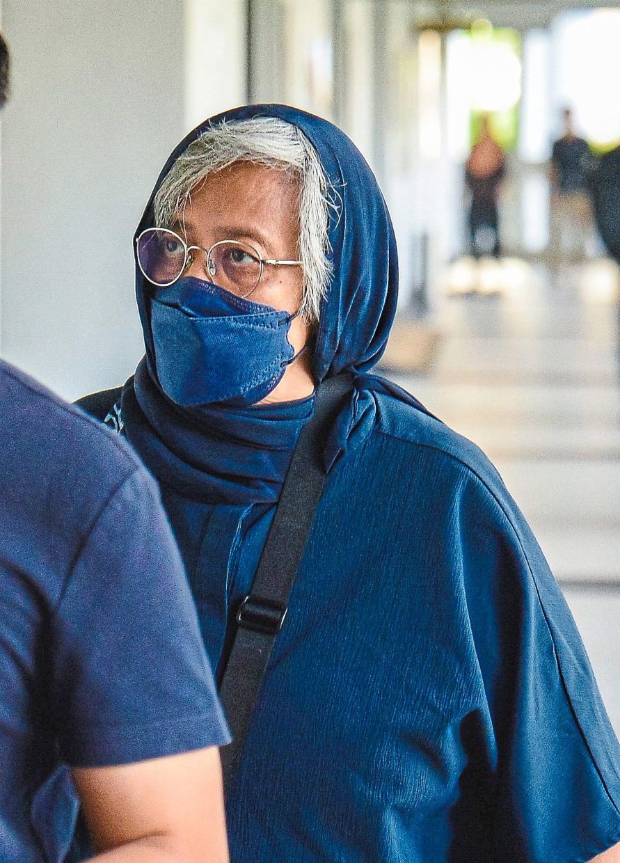 Charged: Asnida arriving at the Kuala Lumpur Court Complex where she claimed trial to the charges. — Bernama
