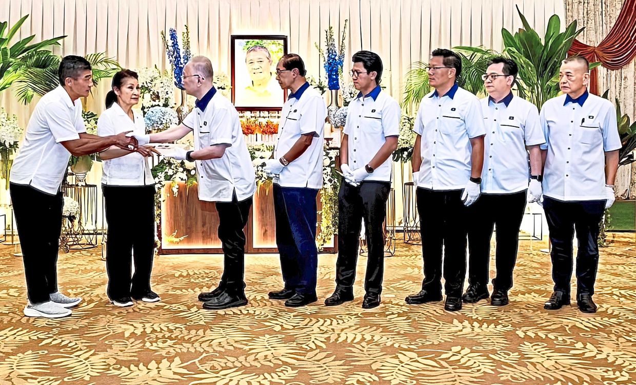 Final tribute: (From left) The late Dr Ling’s son Ling Hee Keat, and his mother Toh Puan Ena Ling, sharing a moment with Dr Wee, Dr Mah, Chong, Lim, Low and Tan.
