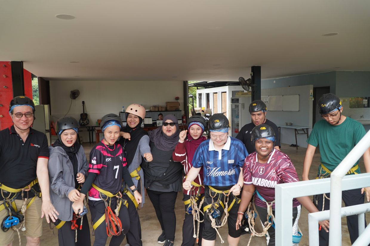 Media representatives gearing up for their thrilling Flying Fox outdoor adventure, with Norazian (centre) cheering them on at Bilut Hills Eco Resort.