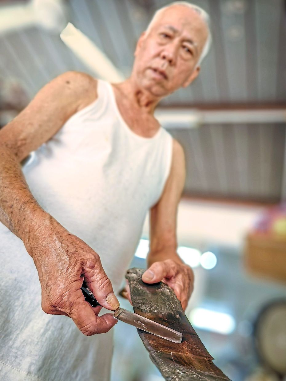Pang still uses a foldable straight razor at his shop in Rifle Range Flats, and is down to his last one.