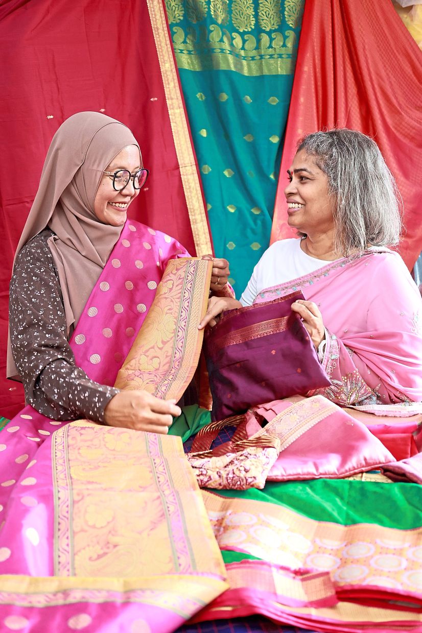 Together, Padmani (right) and Shayida Salmi give pre-loved sarees a second life.