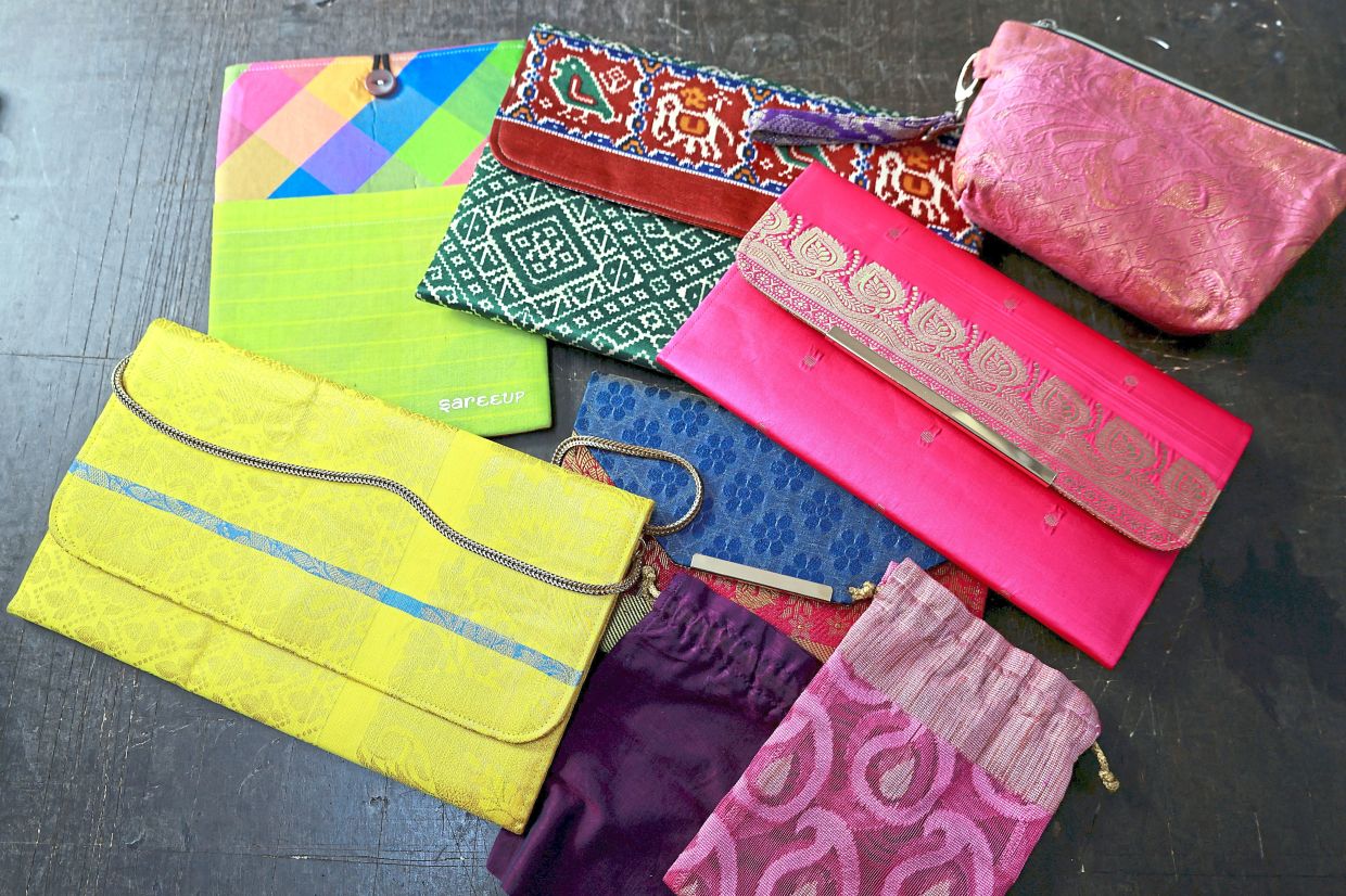 Saree fabrics repurposed into pouches, purses and lanyards.