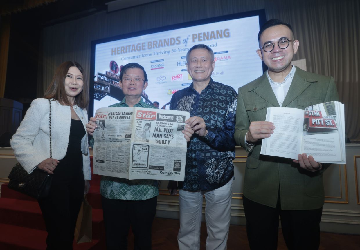 (From L to R)Star Media Group (SMG) client brand marketing (bureaus) general manager Simone Liong presenting Penang Chief Minister Chow Kon Yeow with a copy of The Star's first edition from Sept 9, 1971. With them are 'Heritage Brands of Penang' author Datuk Tony Yeoh and Entrepreneur and Cooperatives Development Minister Steven Sim. — ZHAFARAN NASIB/The Star