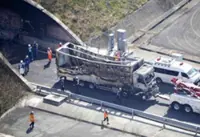 Truck driver arrested over fatal Japan tunnel crash says she was looking at smartphone