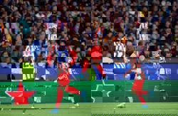 Soccer-Atletico Madrid storm Camp Nou with 2-0 Champions League win over 10-man Barcelona