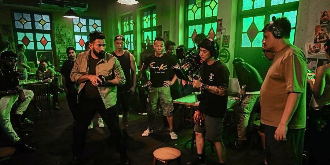 The director (far right) on the set of 'Black Ops'. Photo: Skop Productions/Instagram