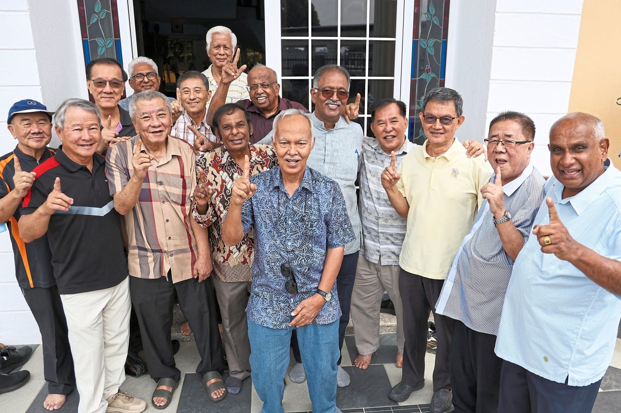 Lawrence (right), Dr Lopez (fifth from right) and Terence (to Dr Lopez’s right, in maroon shirt) and their La Salle Klang former schoolmates coming together to celebrate decades of friendship.