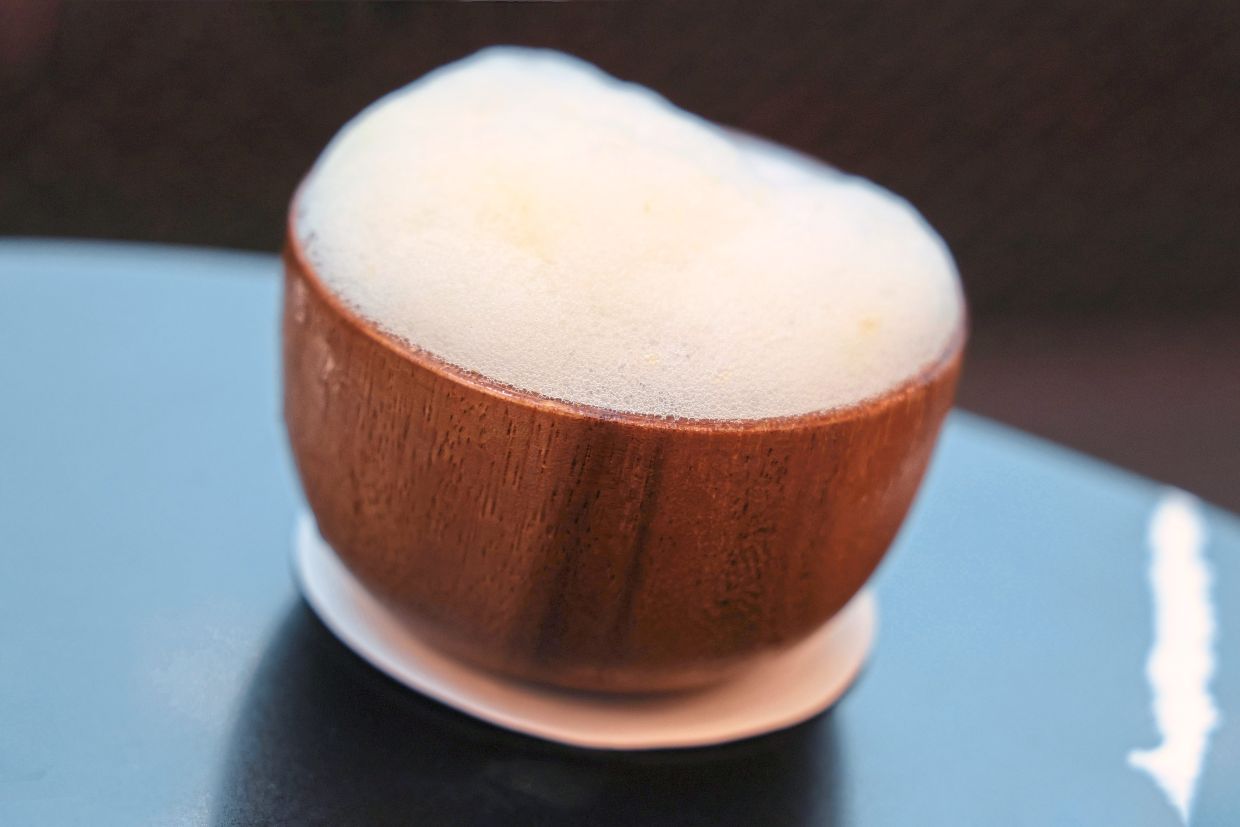 Laksa La Vista is topped with pineapple foam.