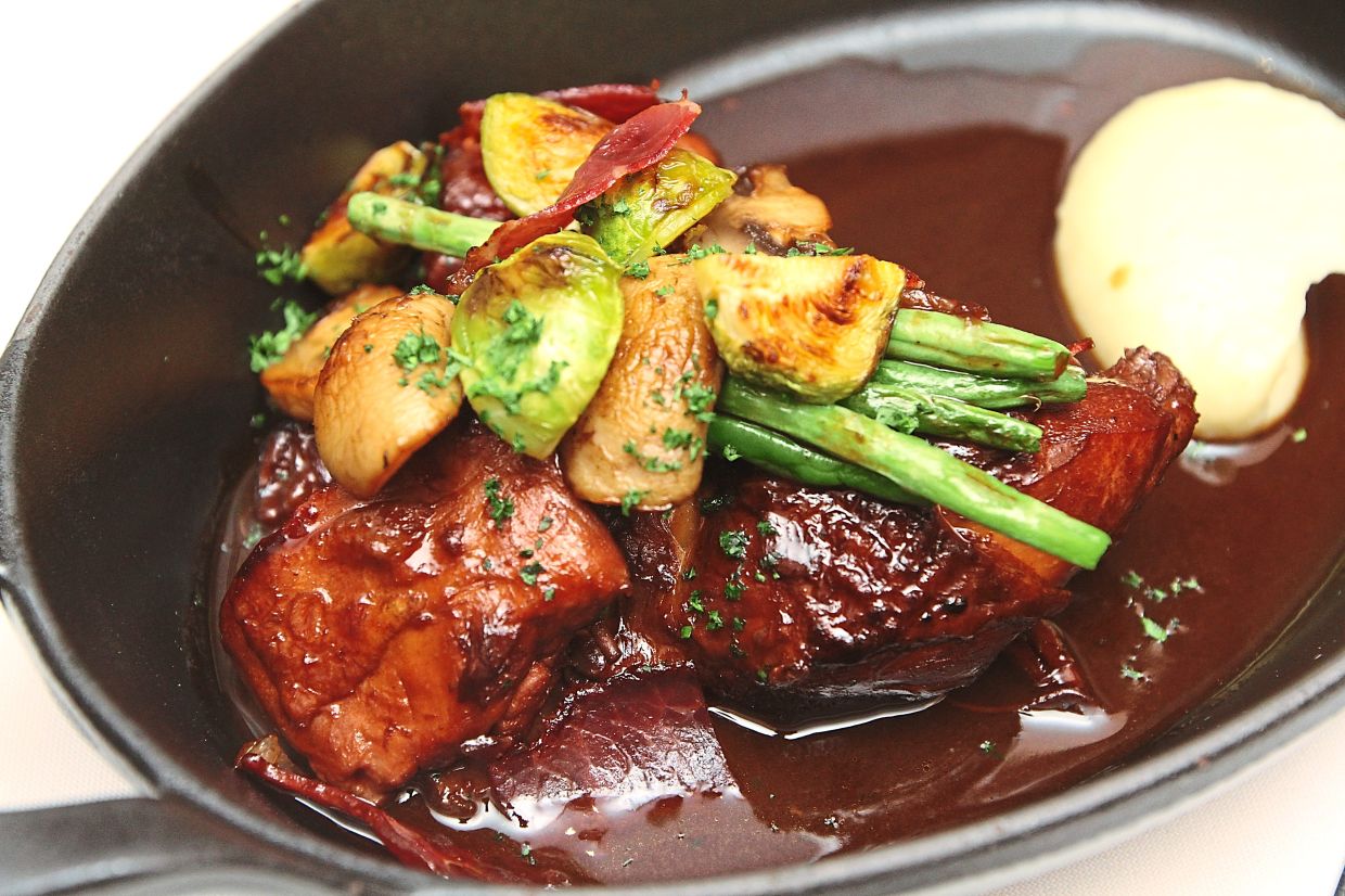 Coq au vin is a classic French village dish that was more widely popularised by Julia Child in the 1960s. — Filepic 