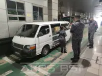 Duo stopped trying to smuggle 888 bottles of liquor from Singapore