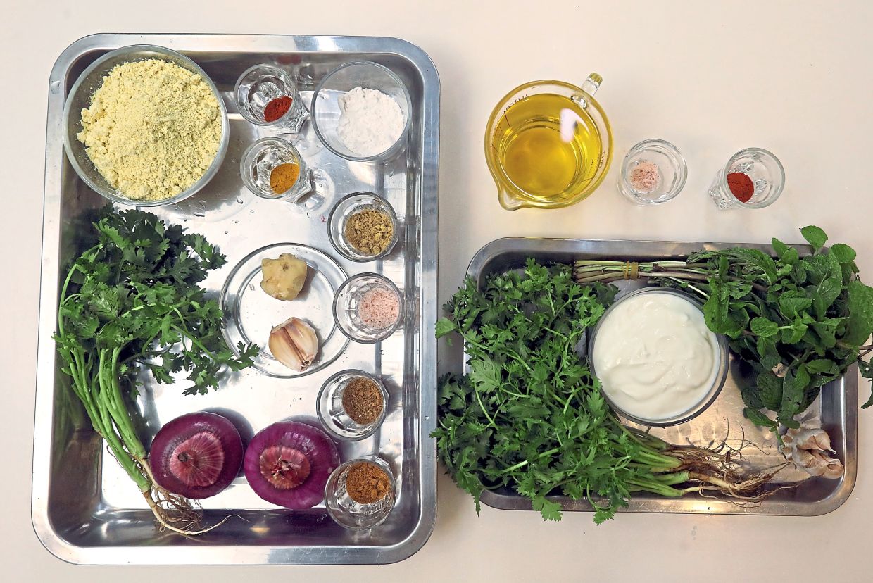 Fresh herbs and spices make up the ingredients for this vegetarian dish enriched with a cool minty yoghurt dip.— AZLINA ABDULLAH/The Star