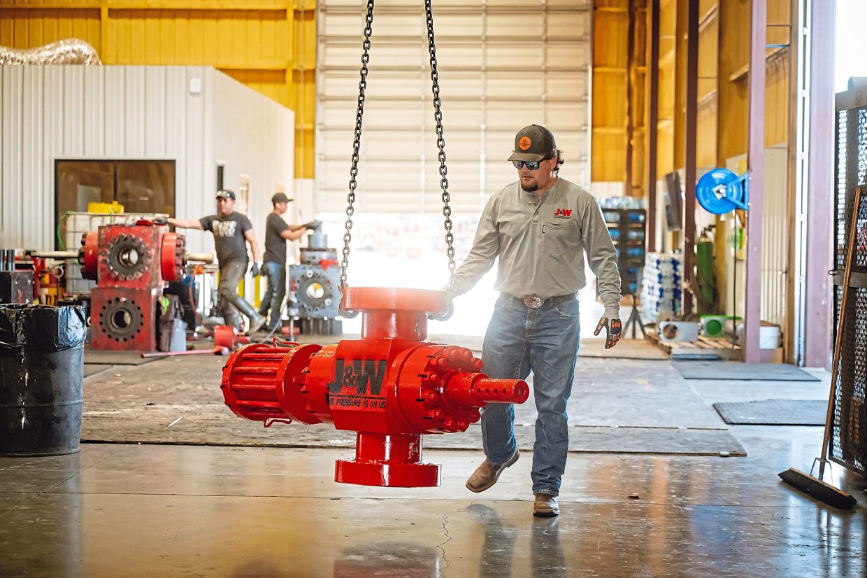 Stephen Smith prepping press control equipment at J&W Services and Equipment Company in Midland, Texas. — Desiree Rios/The New York Times