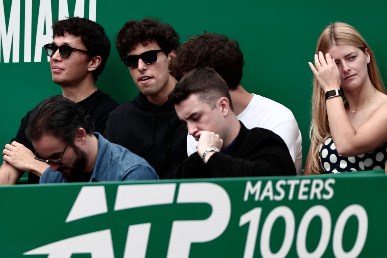 Thailand's F1 driver Alexander Albon (left) and Brazilian F1 driver Gabriel Bortoleto (2nd L) attend the Monte Carlo ATP Masters Series Tournament semi-final tennis match between Italy's Jannik Sinner and Germany's Alexander Zverev on Court Rainier III at the Monte-Carlo Country Club in Roquebrune-Cap-Martin, south-eastern France on Saturday, April 11, 2026. -- Photo by Thibaud MORITZ / AFP