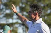 Golf-Carefree McIlroy strengthens grip on Masters title defence