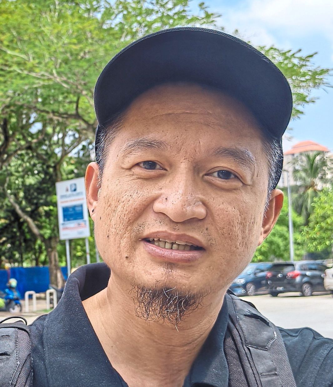 Nik Muhammad says children feel safe when they see their parents calm, so he avoids showing panic and limits their exposure to distressing news.