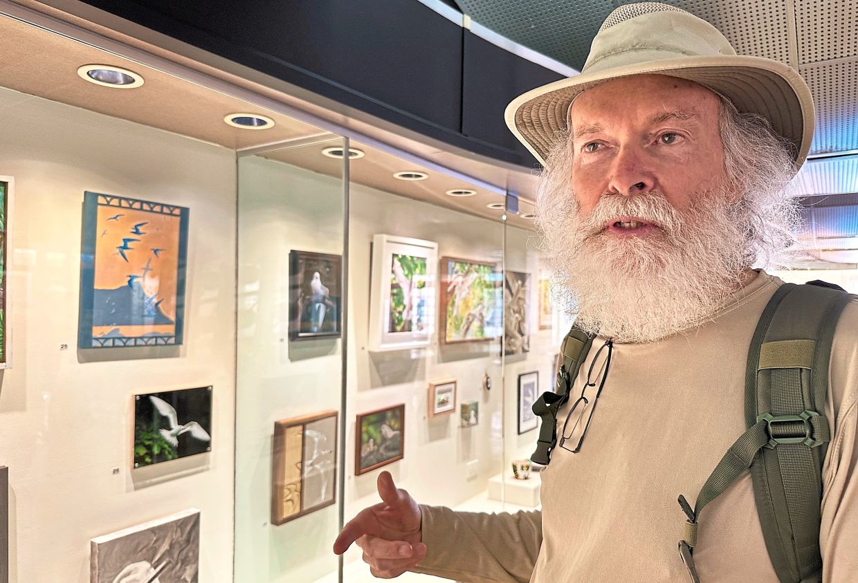 Downs at an art exhibit depicting white tern seabirds at the Capitol Modern: The Hawaii State Art Museum. — AUDREY MCAVOY/AP