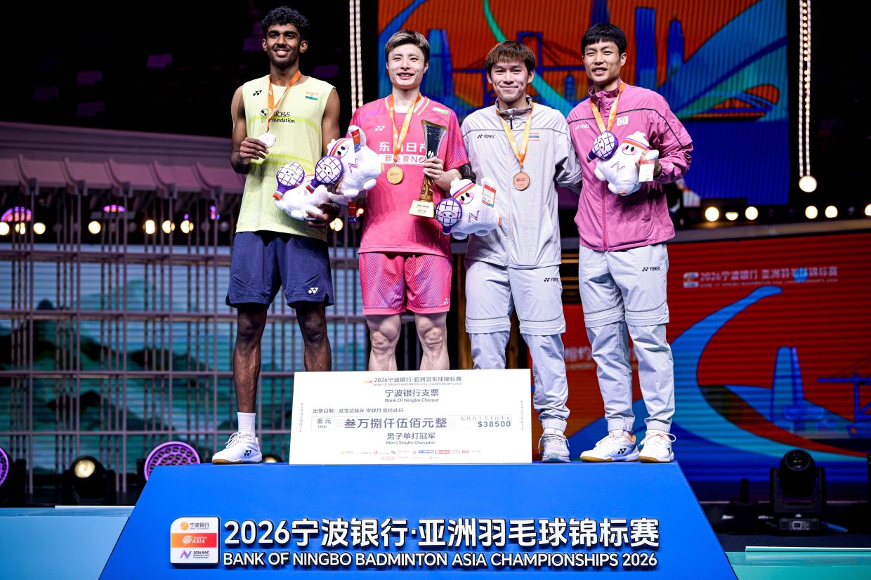 First-placed Shi Yuqi (2nd left) of China, second-placed Ayush Shetty (1st L) of India, and third-placed Kunlavut Vitidsarn (second R) of Thailand and Chou Tien Chen of Chinese Taipei pose for group photos during the men's singles awarding ceremony at the Badminton Asia Championships 2026 in Ningbo, east China's Zhejiang Province, on Sunday, April 12, 2026. -- Photo: Xinhua/Jiang Han