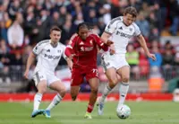 Soccer-Ngumoha makes Anfield history, Salah seals Liverpool win over Fulham